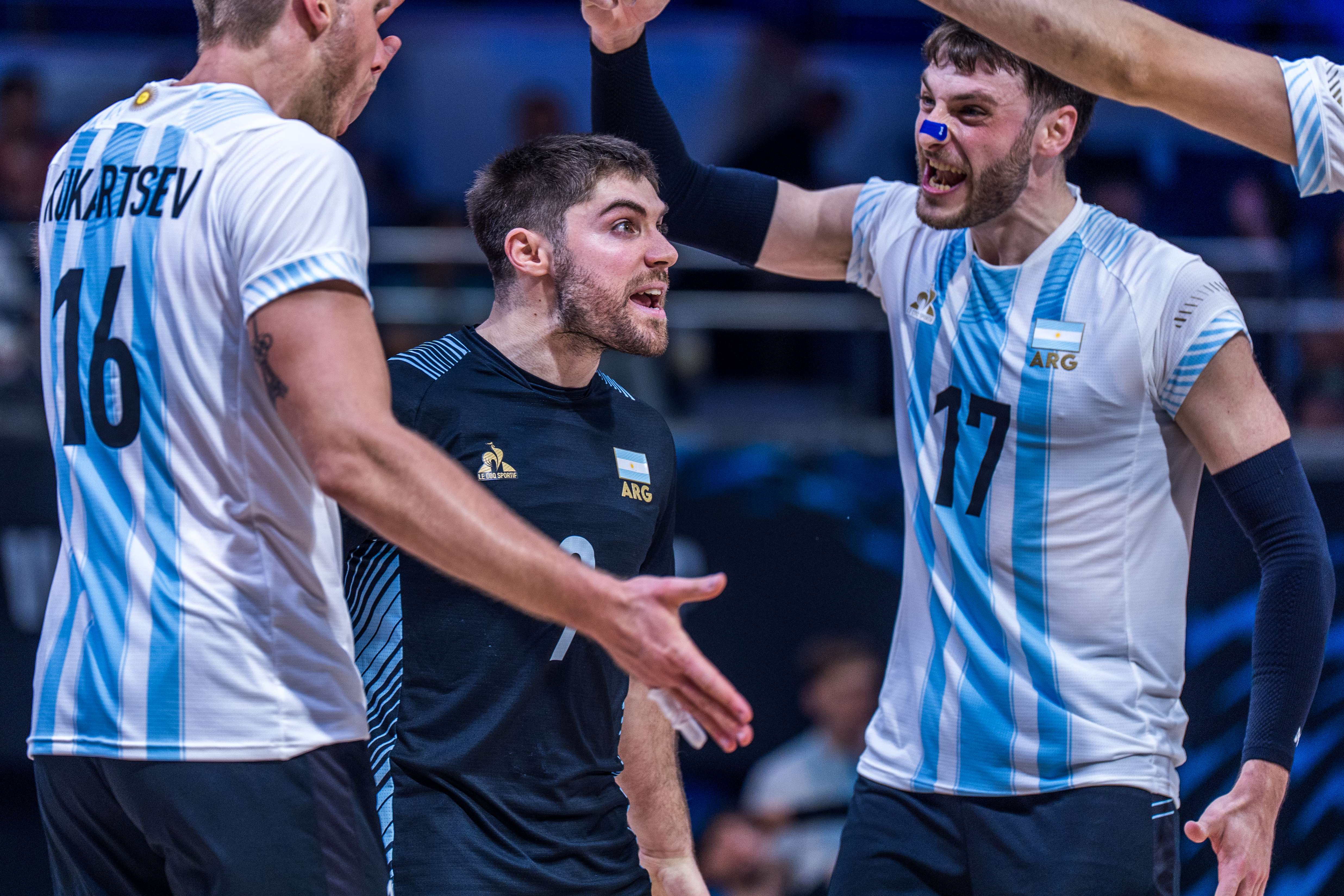 Volleyball players celebrating a point