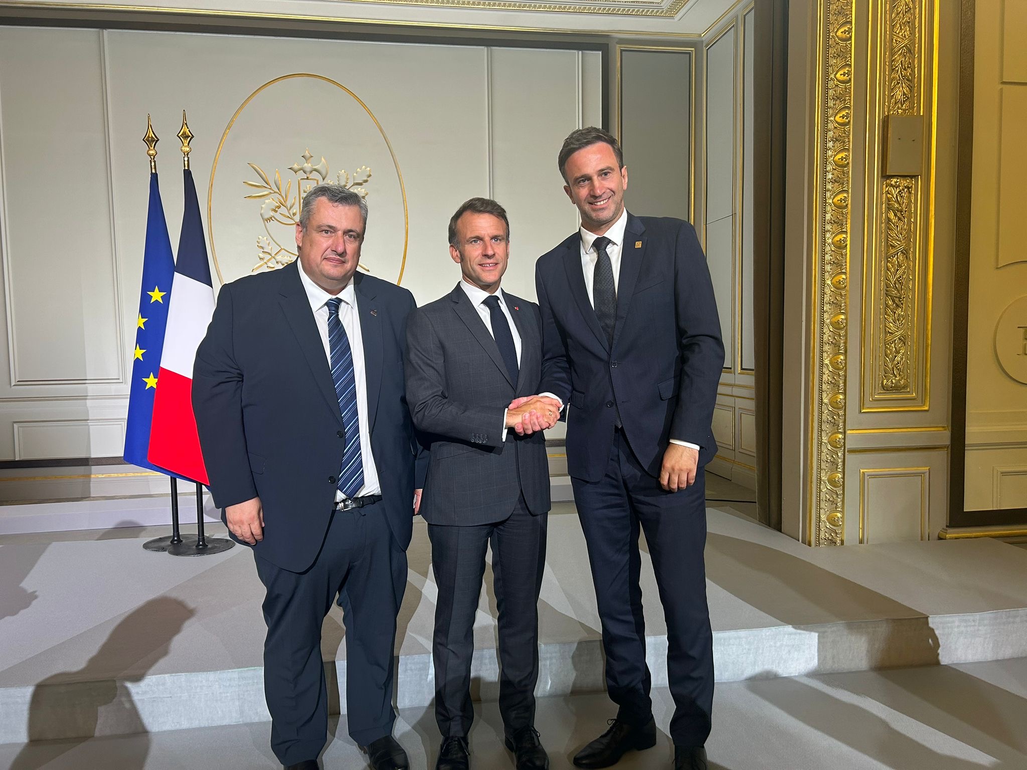 CEV President Roko Sikirić shaking hands with French President Emmanuel Macron