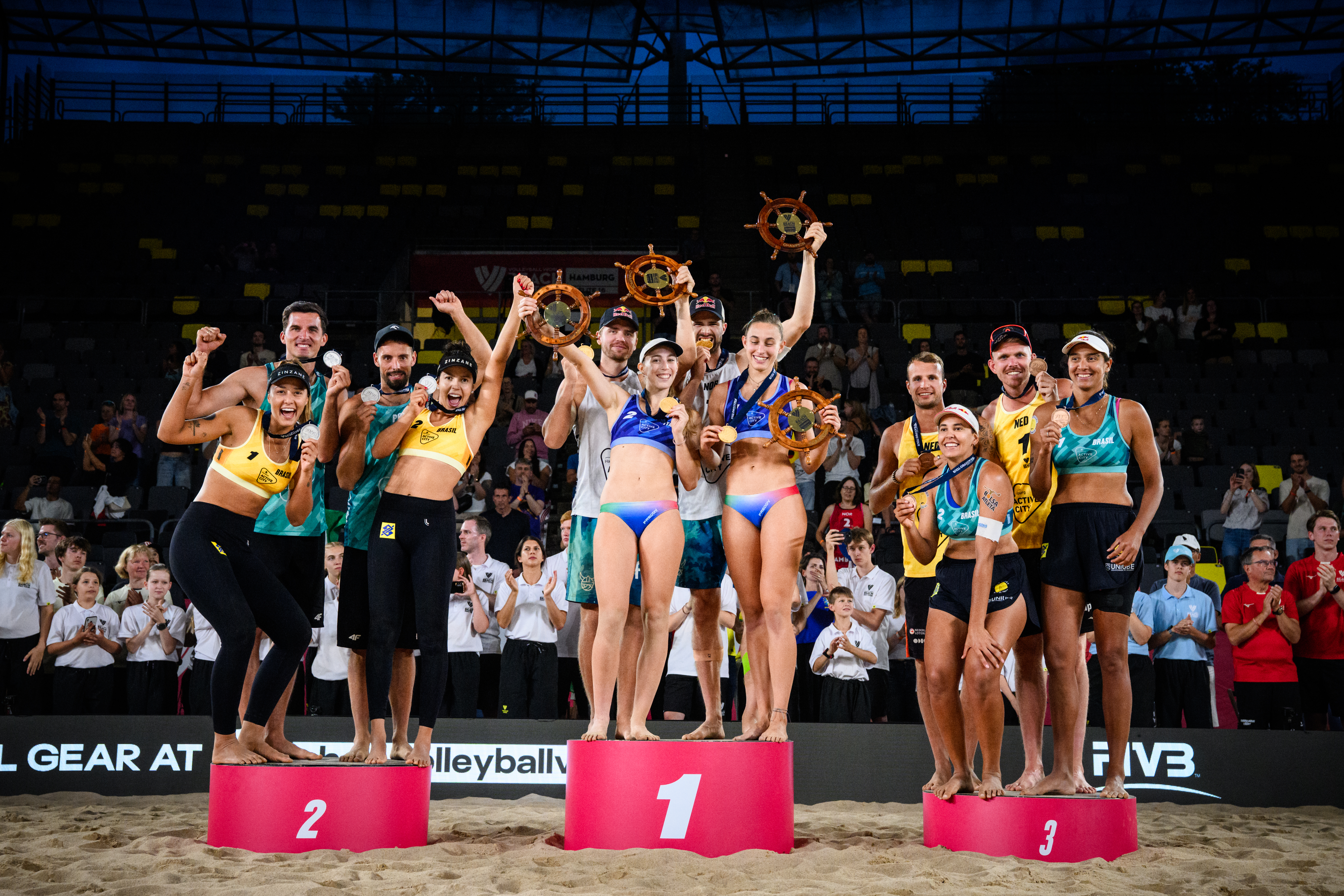 Podium ceremony at Hamburg Beach Pro Tour, with teams from Norway, Italy, Poland, and the Netherlands