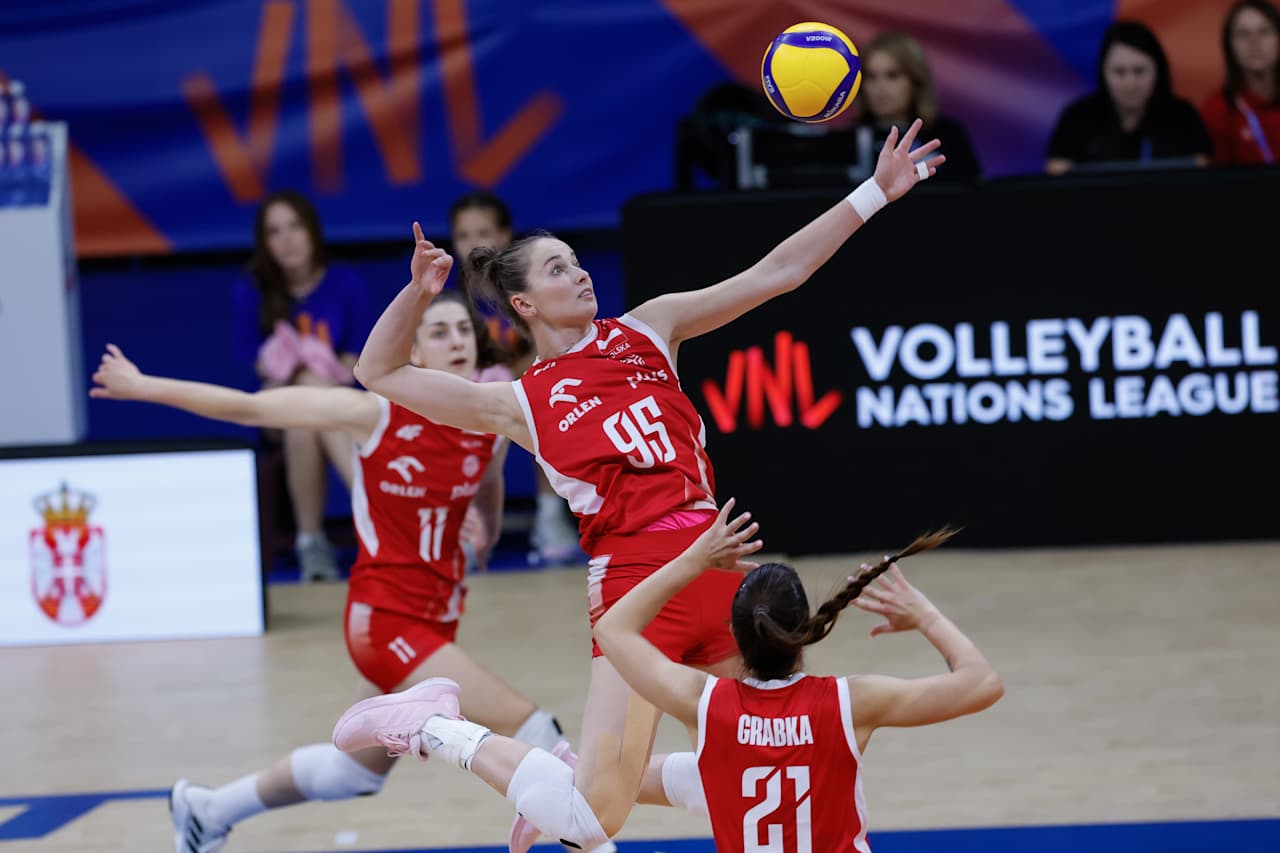 Volleyball players celebrating a point