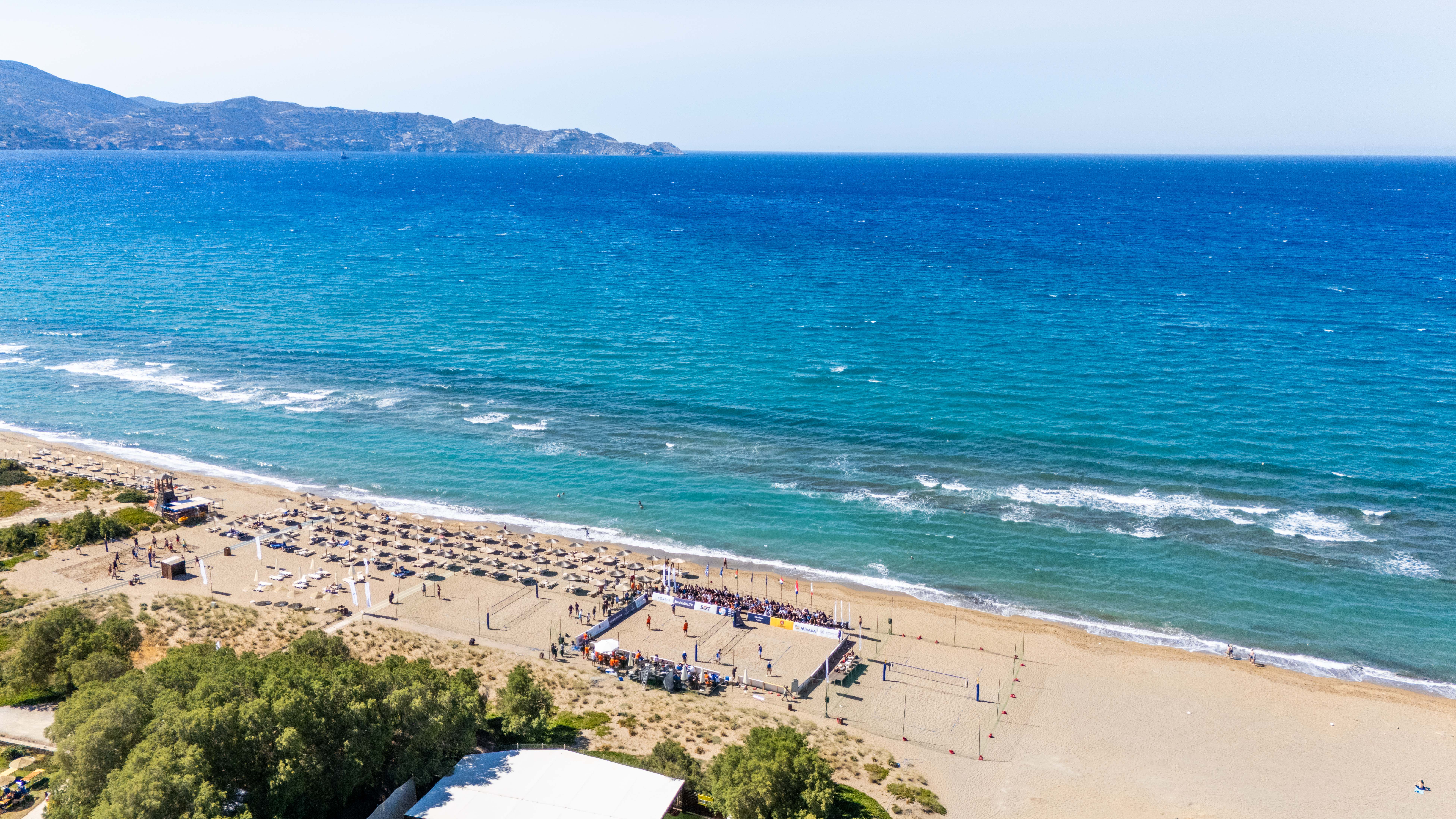 Aerial view of a beach volleyball court in a scenic location