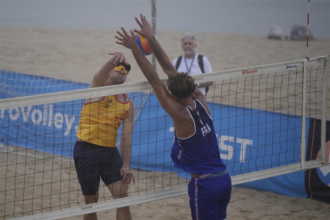Beach volleyball players from Spain and France during a match