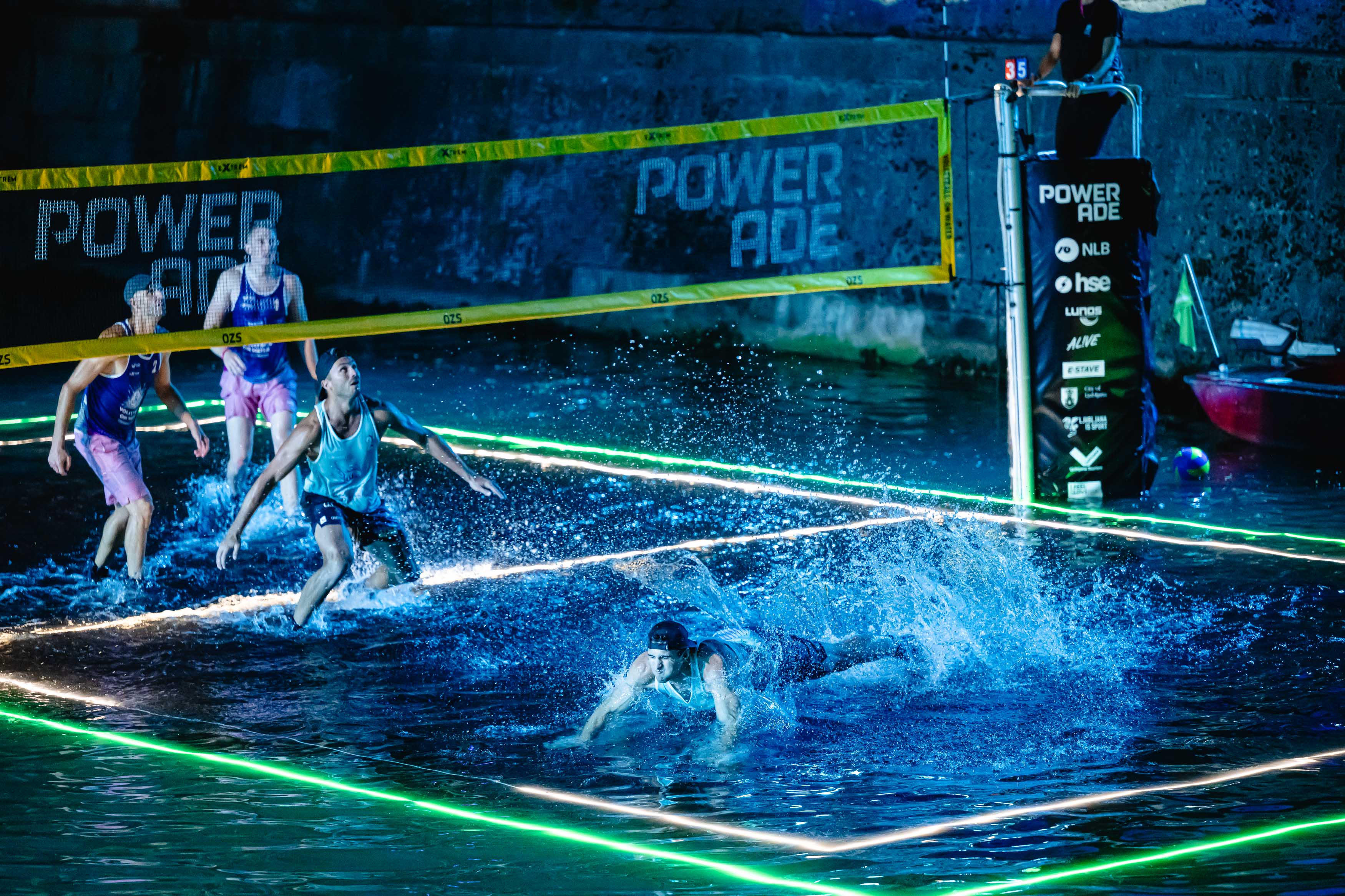 Volleyball players in action on the unique water court in Ljubljana.