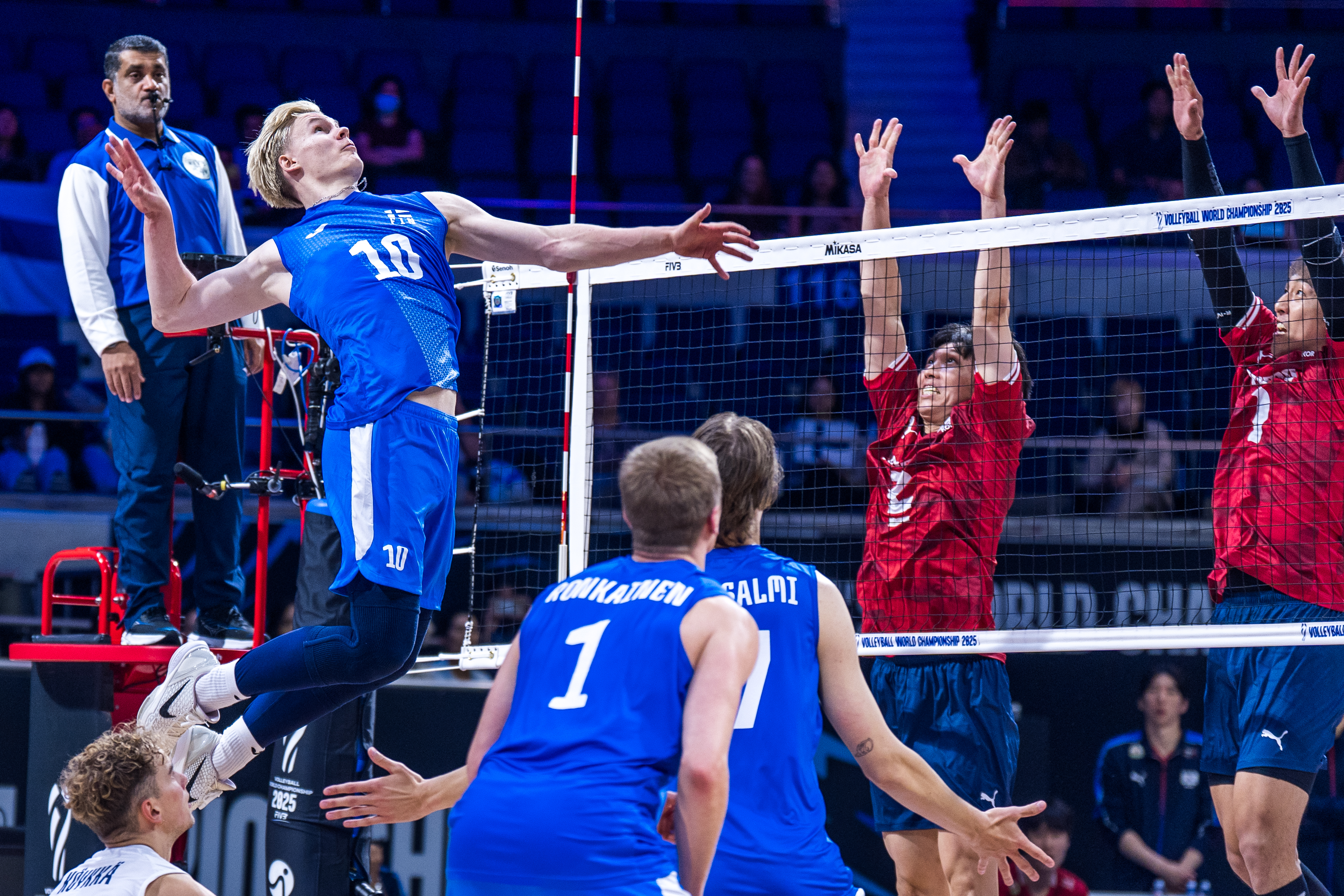 Volleyball player serving the ball