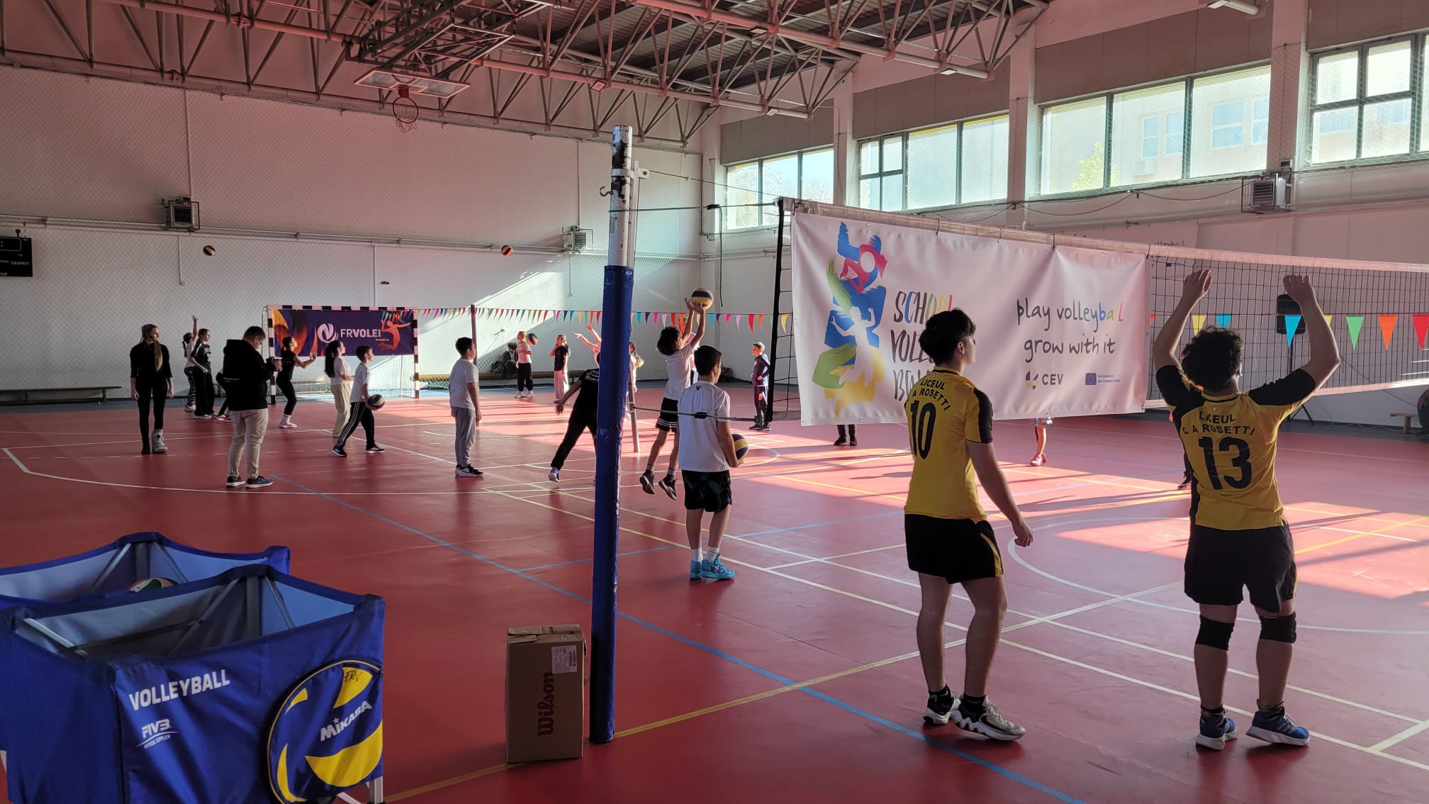 Children playing volleyball, representing the CEV School Project`s goals.