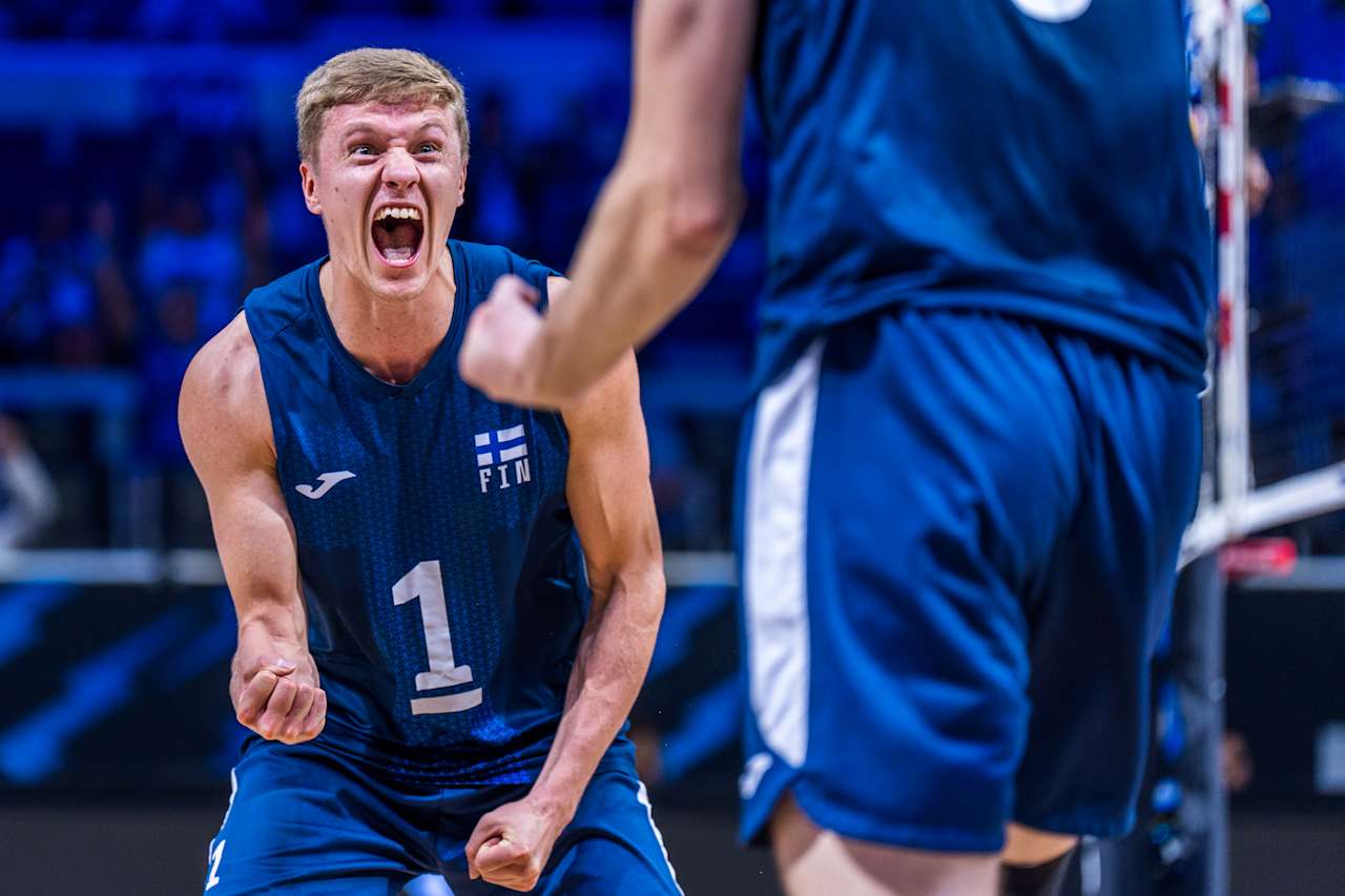 Dynamic shot of a volleyball player mid-action during a match