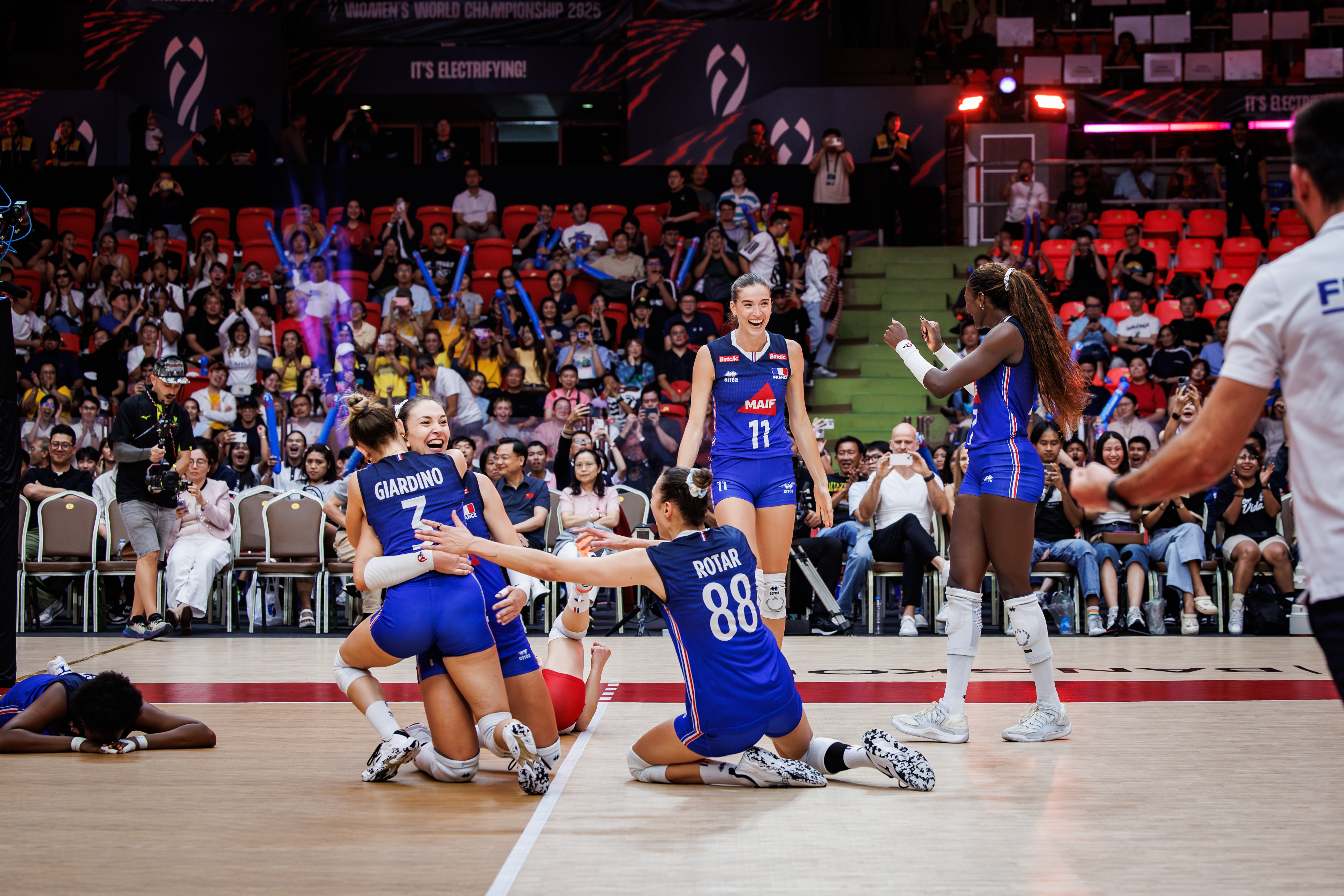 French national volleyball team celebrating their victory against China