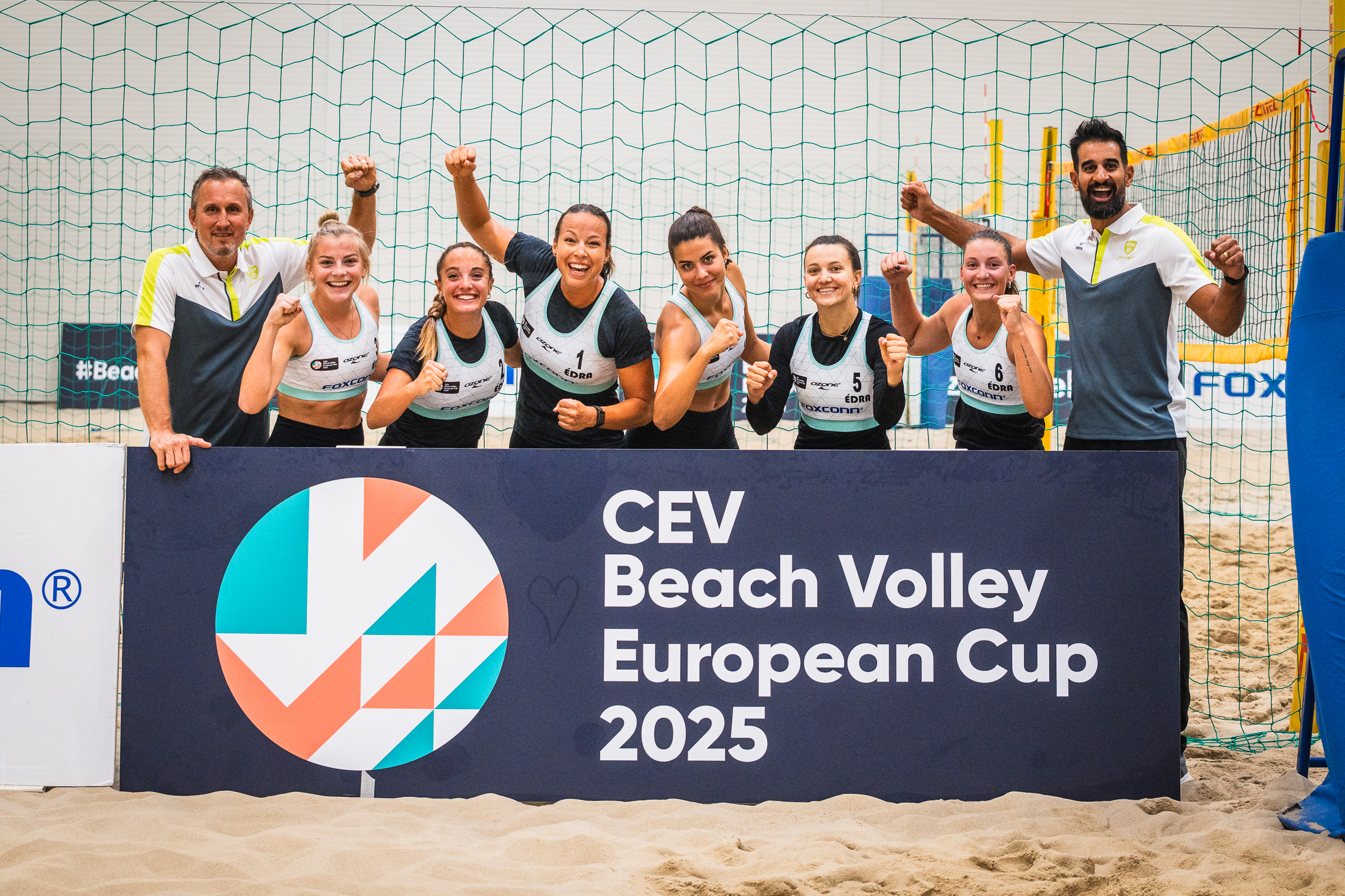 A beach volleyball match in progress