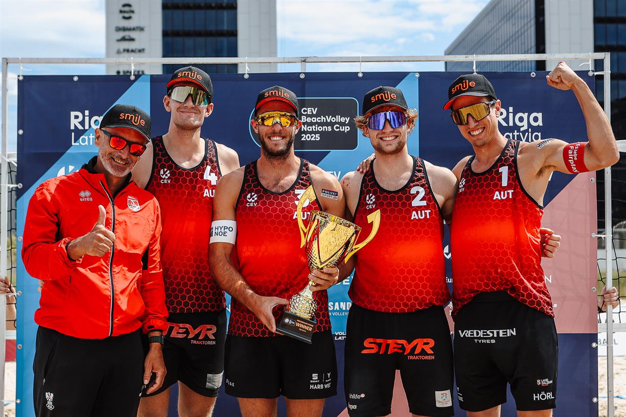 Austrian men`s team with trophy