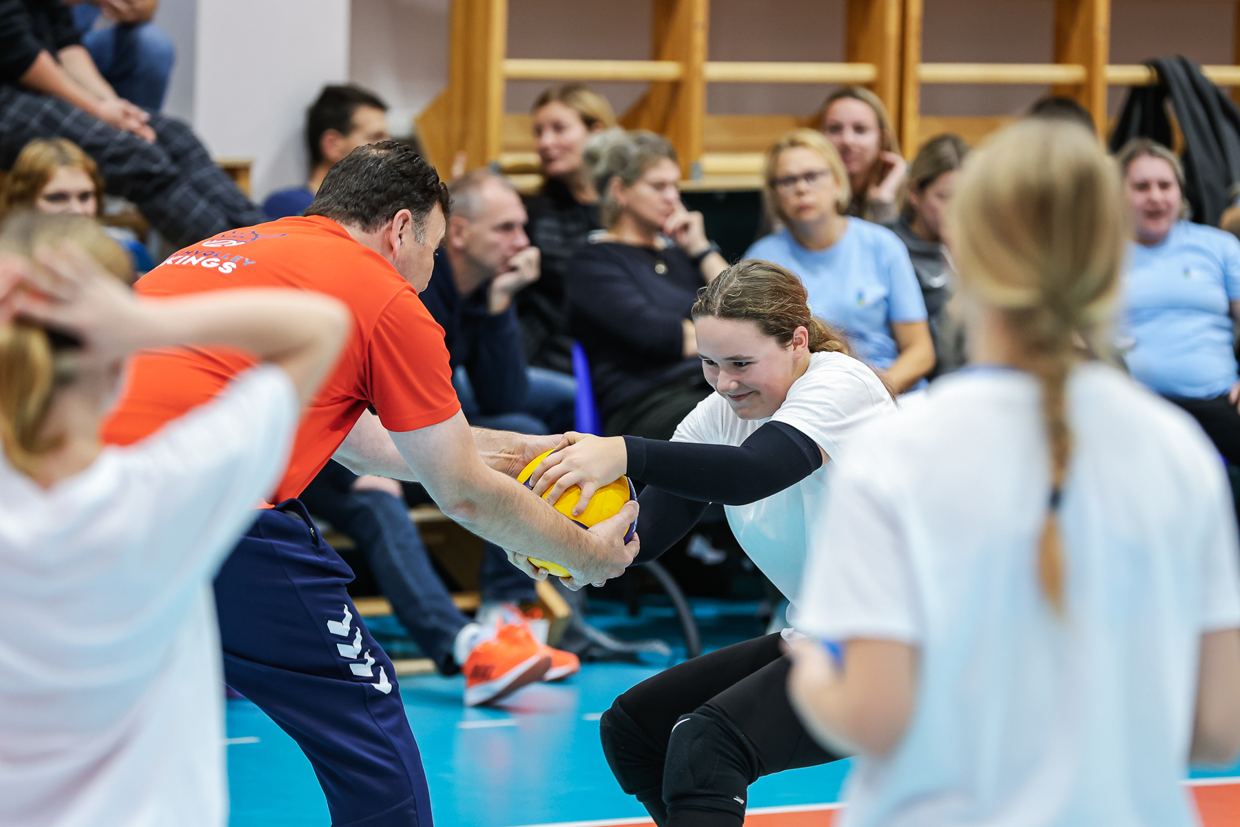 Participants attentively observing a demonstration during the Youth Coaching Course.