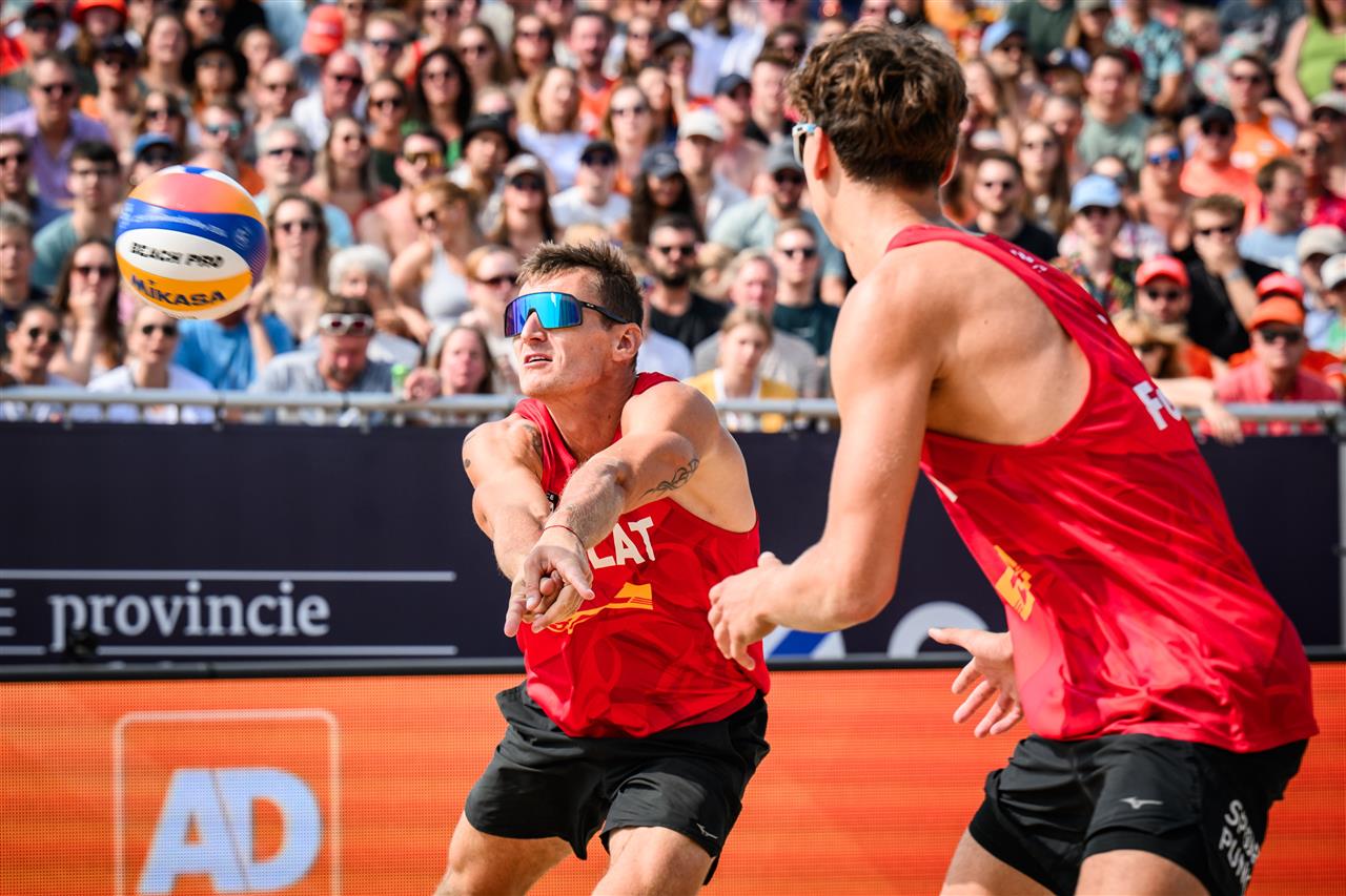 Martins Plavins and Kristians Fokerots playing beach volleyball